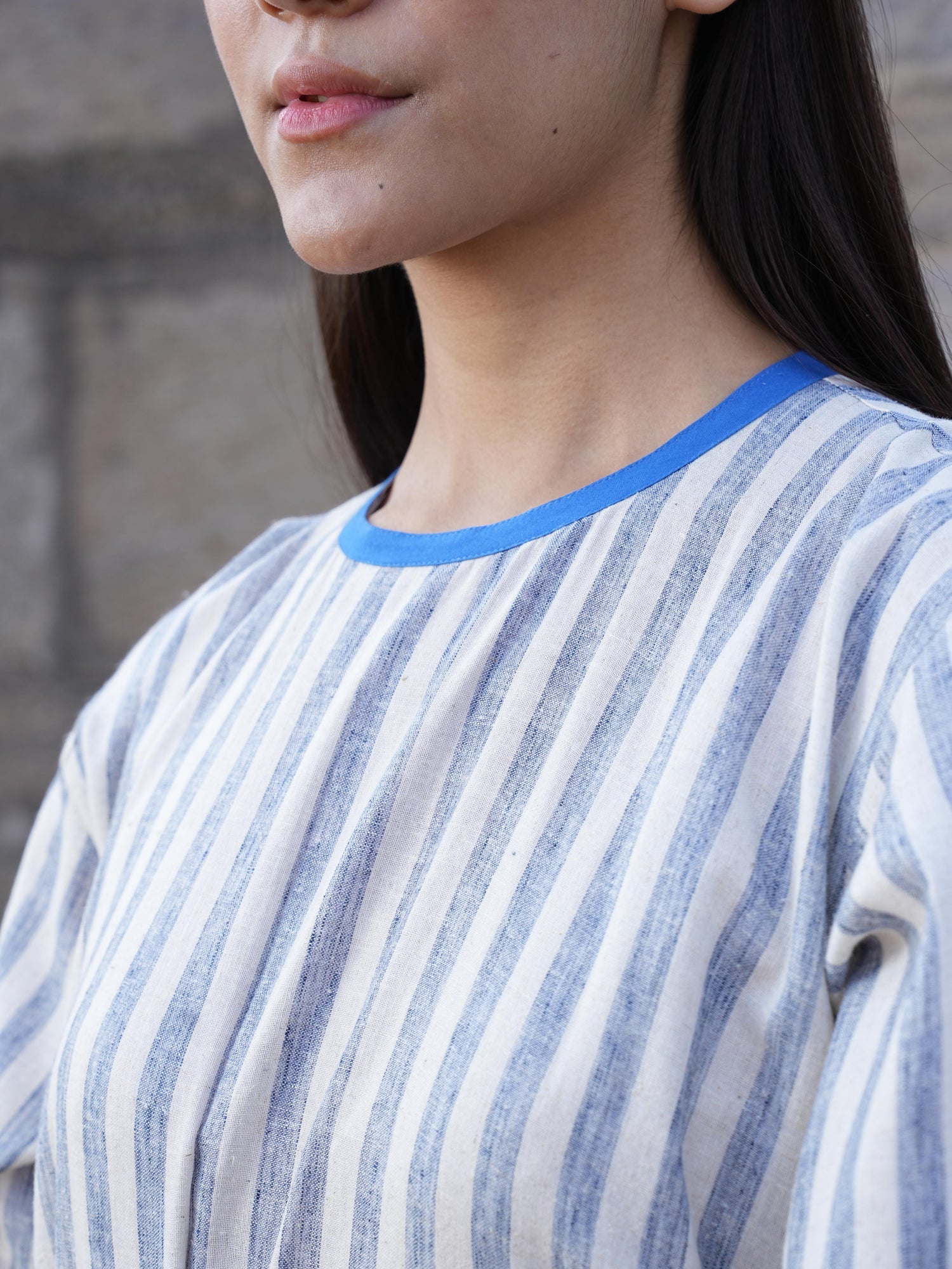 Detail of the clean French-seam finish on the striped cotton dress
