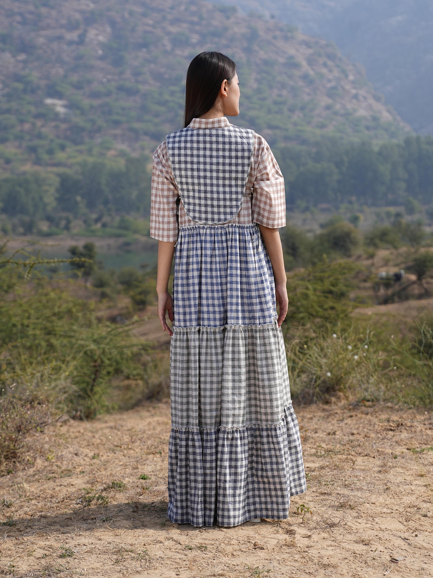 Detail of the clean French-seam finish on the checked cotton maxi dress