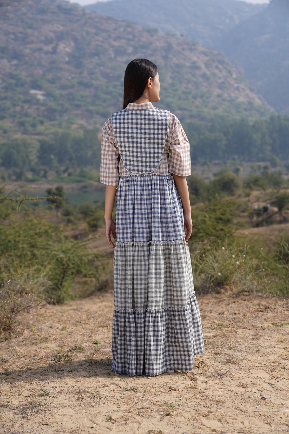 Detail of the clean French-seam finish on the checked cotton maxi dress