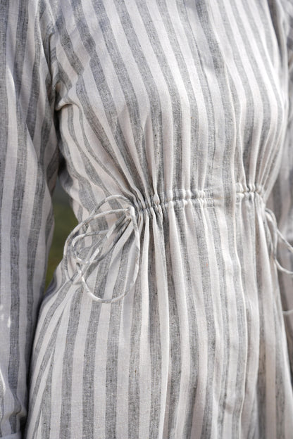 Model styling the striped cotton maxi dress for a warm summer day