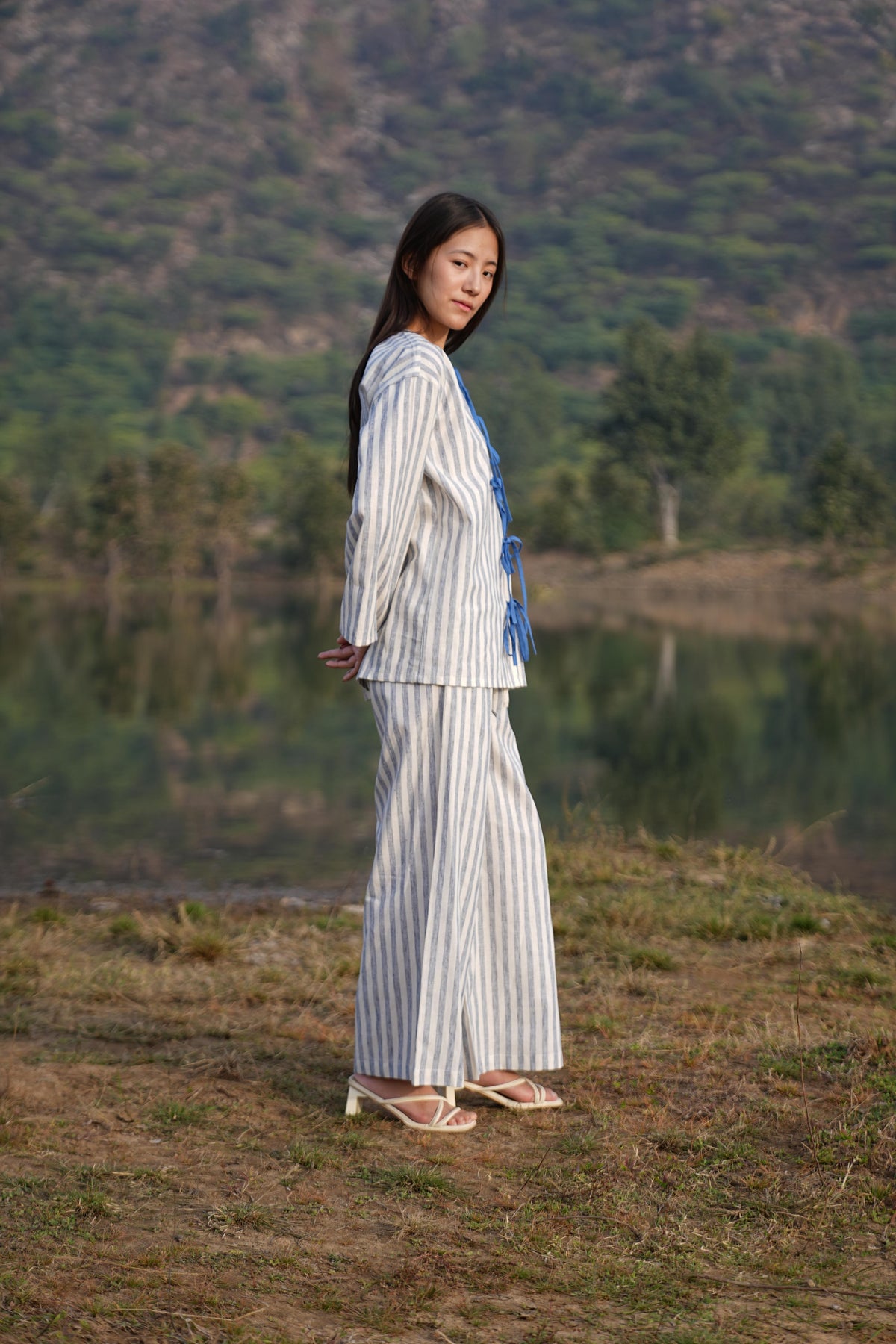 The long-sleeve tunic shown open over the matching striped trousers