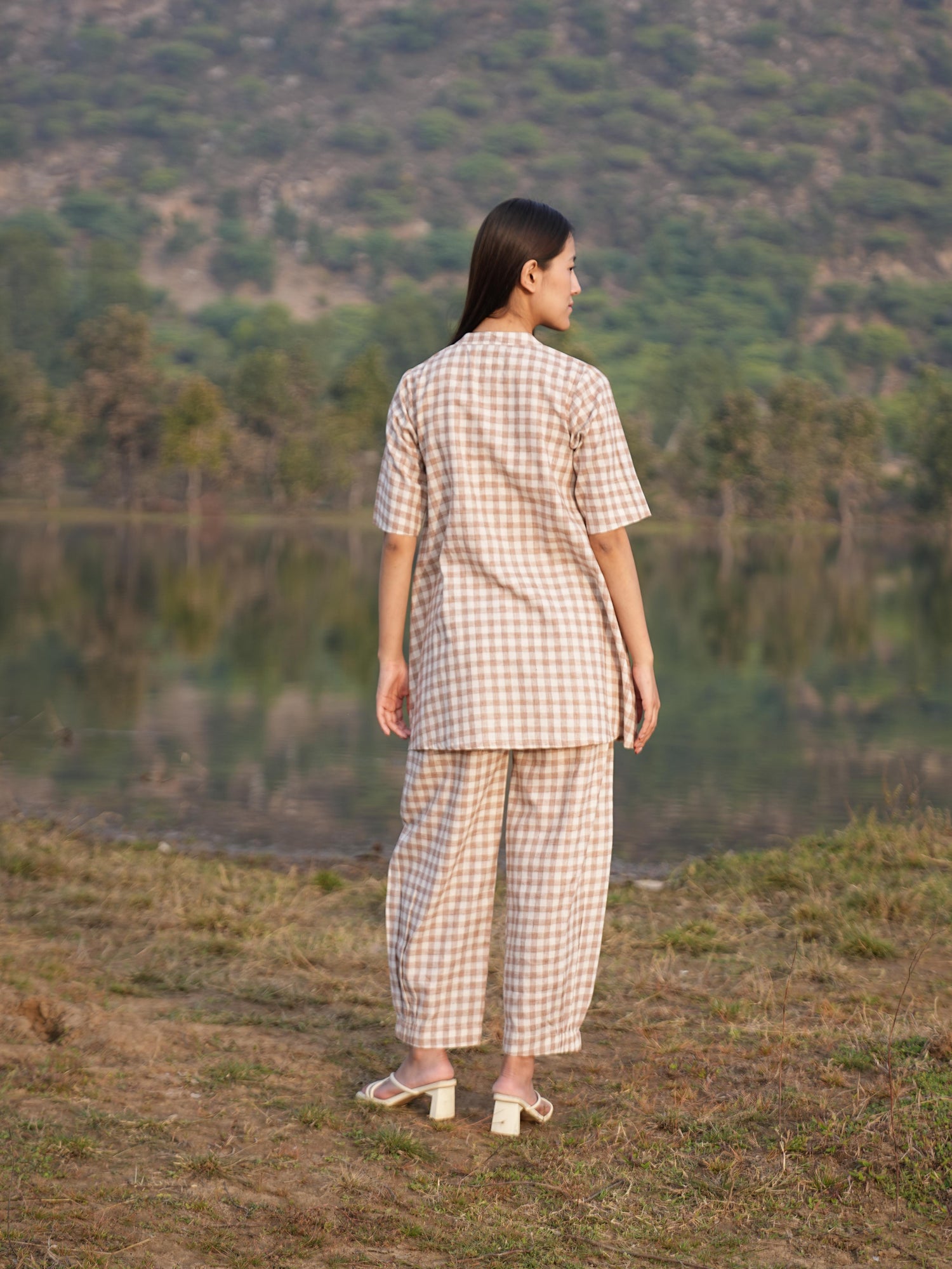 Side profile of the checked cotton co-ord set, showing its relaxed drape