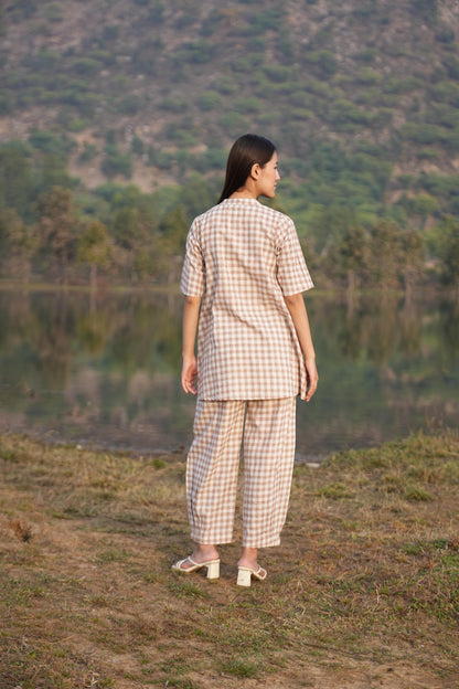 Side profile of the checked cotton co-ord set, showing its relaxed drape