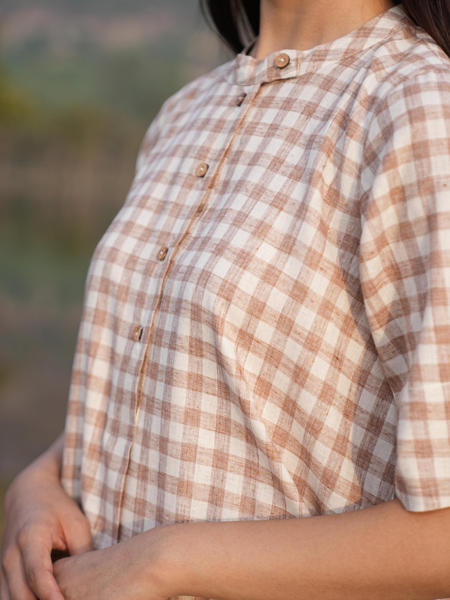 Detail of the clean French-seam finish on the checked cotton co-ord set