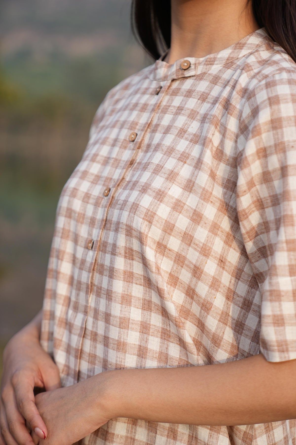 Detail of the clean French-seam finish on the checked cotton co-ord set