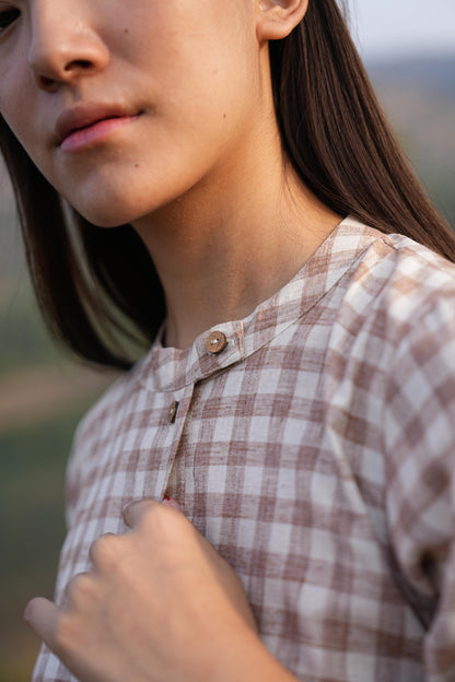 Model styling the checked cotton co-ord set for a warm summer day